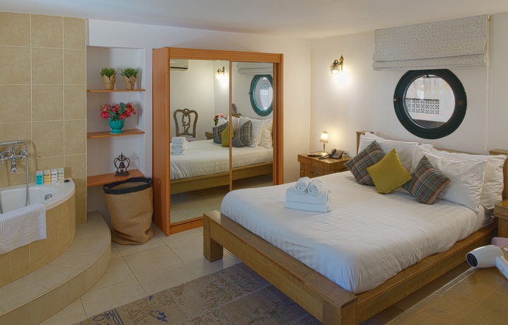 Imagen de la habitación del Margosa Hotel. Foto 6