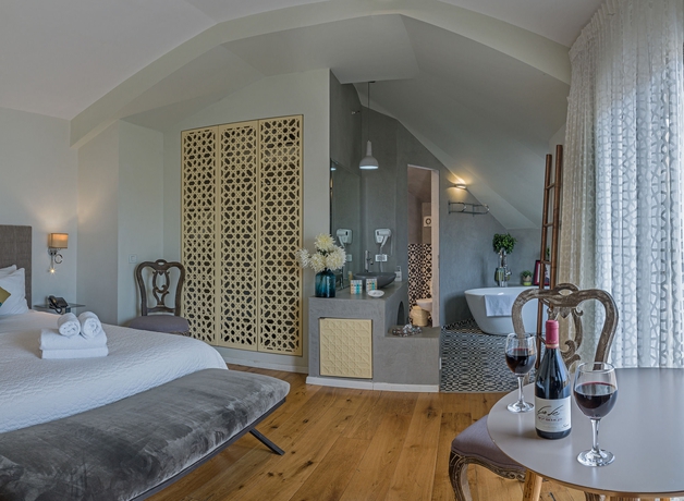 Imagen de la habitación del Margosa Hotel. Foto 9