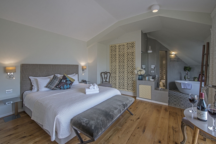 Imagen de la habitación del Margosa Hotel. Foto 11