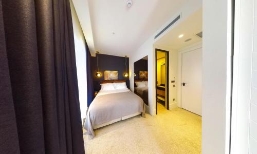 Imagen de la habitación del Maroon Tomtom. Foto 18