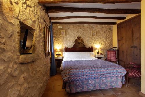 Imagen de la habitación del Mas la Planella Masia de Turismo Rural. Foto 18