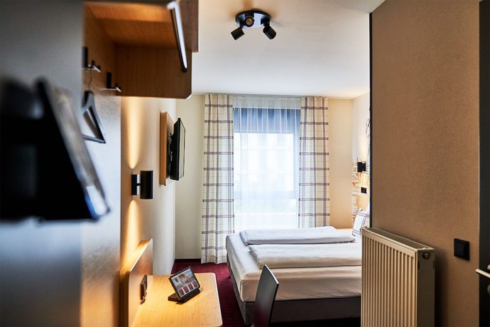 Imagen de la habitación del McDreams Hotel München Messe. Foto 9