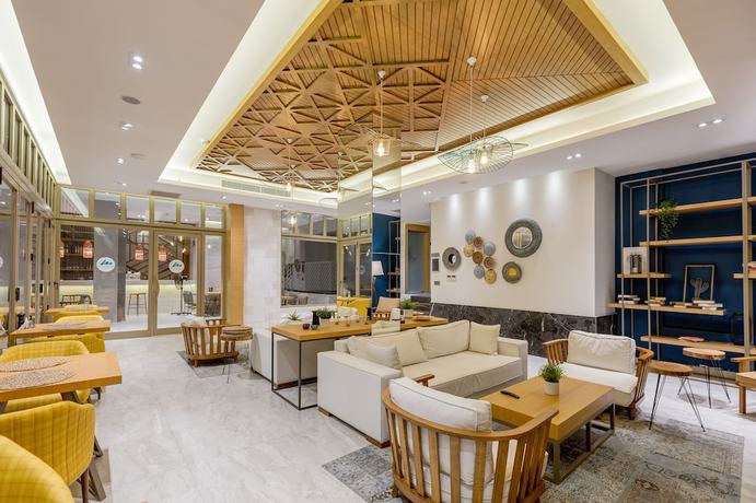 Imagen del bar/restaurante del Melanippe Relaxing Hotel - Adults Only. Foto 2