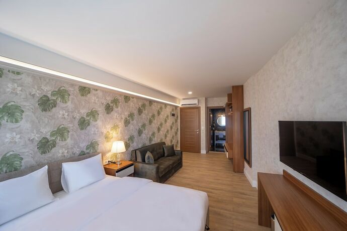 Imagen de la habitación del Mell City Suite Hotel. Foto 14