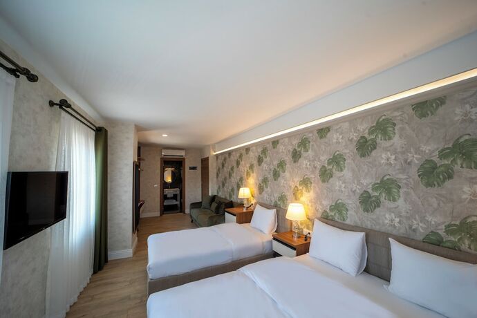 Imagen de la habitación del Mell City Suite Hotel. Foto 16