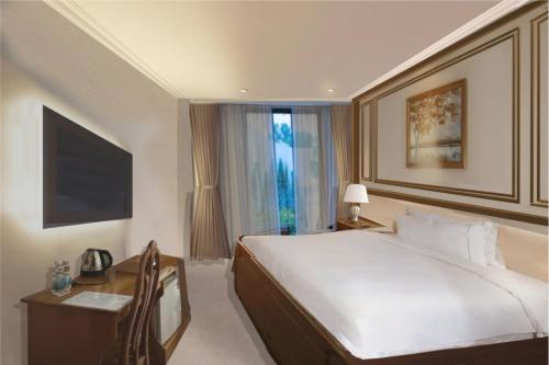 Imagen de la habitación del MerPerle Nui Sam Resort. Foto 19