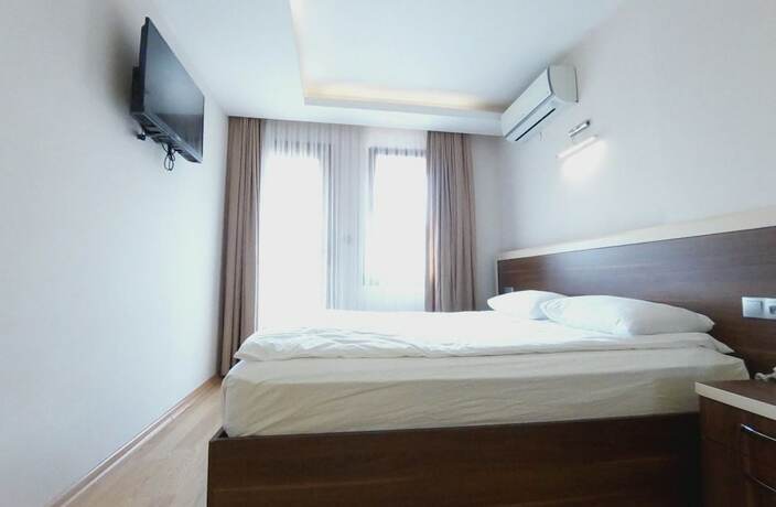 Imagen de la habitación del Merkez Otel, Konak. Foto 18