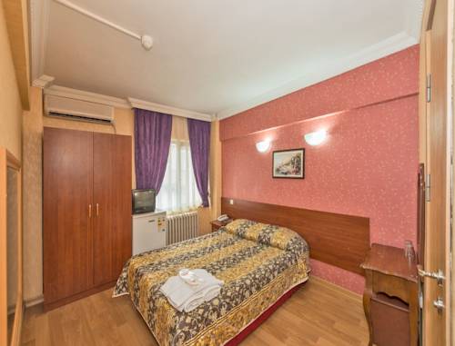 Imagen de la habitación del Metro Hotel. Foto 5