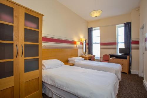 Imagen de la habitación del Metropole Hotel. Foto 7