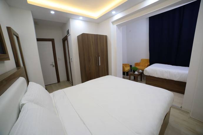 Imagen de la habitación del Mitani Suites. Foto 16
