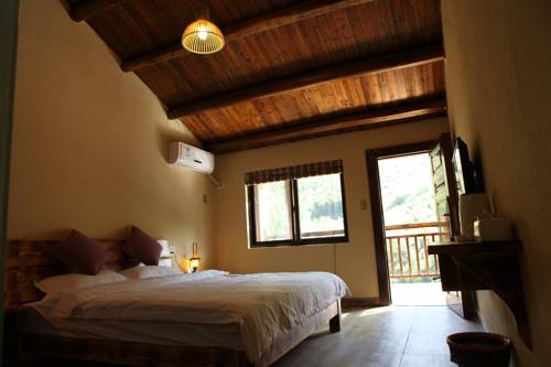 Imagen de la habitación del Moganshan Pinhouwu Hotel. Foto 1