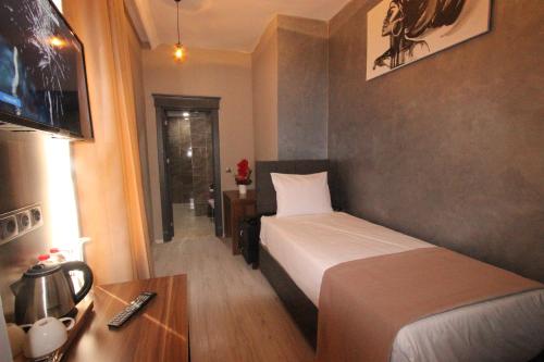Imagen de la habitación del Monezza Hotel. Foto 15