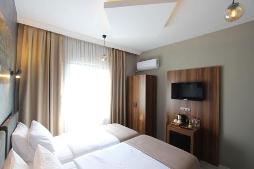 Imagen de la habitación del Monezza Hotel. Foto 18