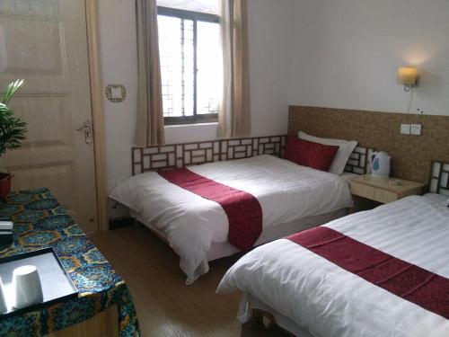 Imagen de la habitación del Moshangke Style Inn. Foto 3