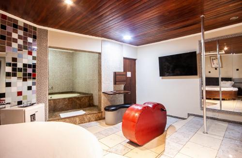 Imagen de la habitación del Motel Jardim Secreto. Foto 15
