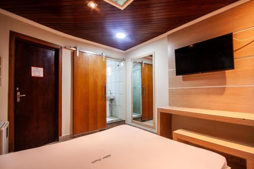Imagen de la habitación del Motel Jardim Secreto. Foto 19