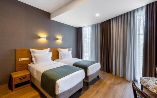 Imagen de la habitación del Mukhrantubani Boutique Hotel. Foto 17
