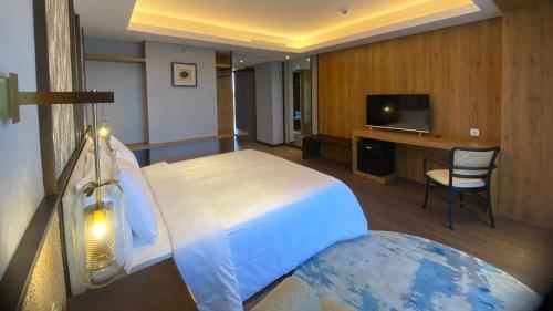 Imagen de la habitación del Myze Hotel Sumenep. Foto 12