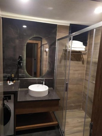 Imagen de la habitación del NEHIR OTEL. Foto 13