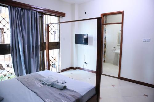 Imagen general del NYALI ENSUITE ROOMS WITH SWIMMING POOL, MOMBASA. Foto 9