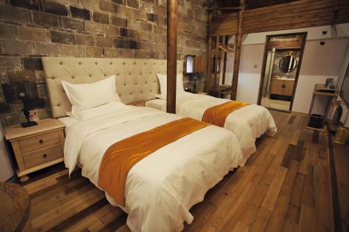 Imagen de la habitación del Nan Xiang Zi Guesthouse. Foto 6