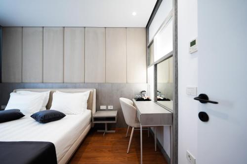 Imagen de la habitación del Naos Luxury Hotel. Foto 16