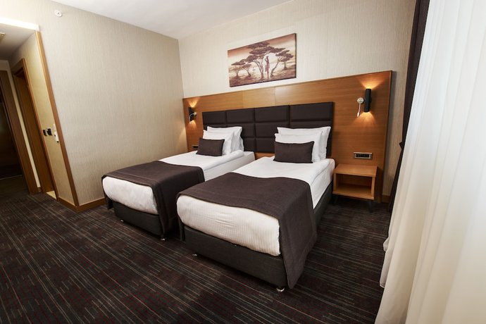 Imagen de la habitación del New Garden Hotel. Foto 15