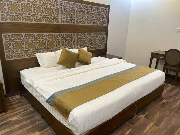 Imagen de la habitación del New Holiday Serviced Apartments. Foto 19