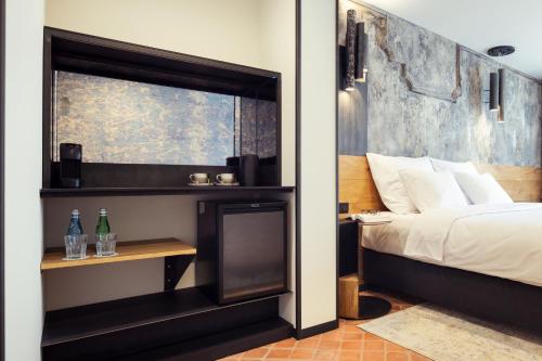 Imagen de la habitación del Nomadic Urban Premium Suites. Foto 7