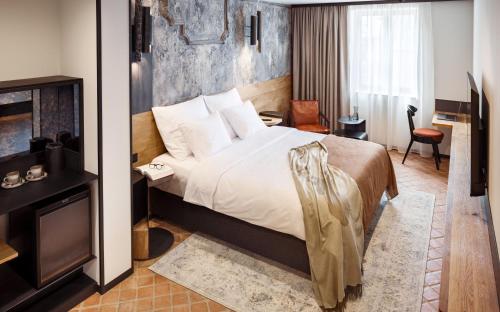 Imagen de la habitación del Nomadic Urban Premium Suites. Foto 10