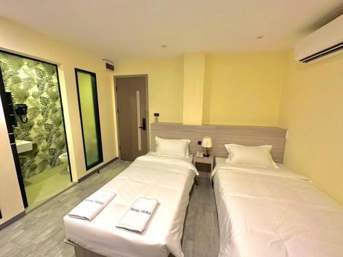 Imagen de la habitación del Nona Hotel, Bangkok. Foto 17