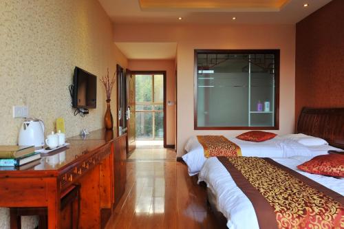 Imagen de la habitación del Nong Yue .emeishan Ju. Foto 5