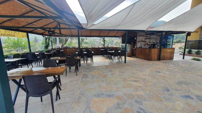Imagen del bar/restaurante del OLIVE TREE APART HOTEL. Foto 5