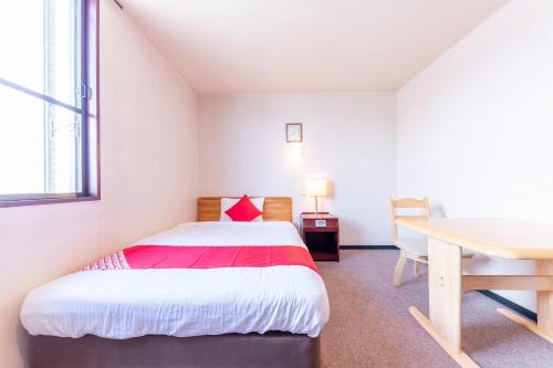 Imagen de la habitación del OYO Hotel Travel Inn Shinshu Nakano. Foto 9