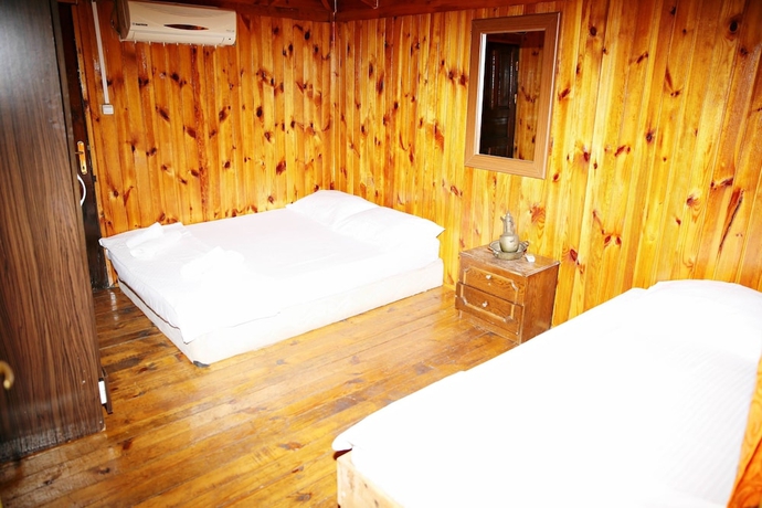 Imagen de la habitación del Olimpos Salinas Wooden Houses. Foto 9