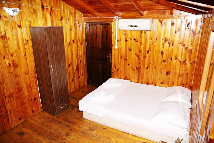 Imagen de la habitación del Olimpos Salinas Wooden Houses. Foto 11