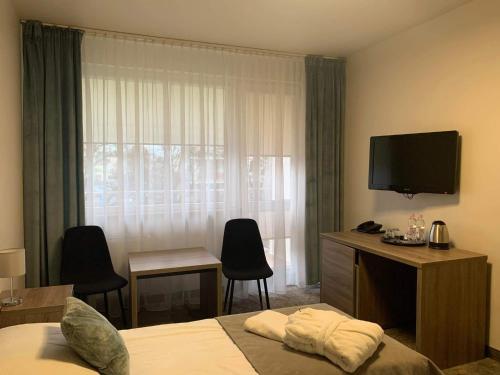 Imagen de la habitación del Ośrodek Rehabilitacyjno-Wczasowy Magnolia. Foto 14