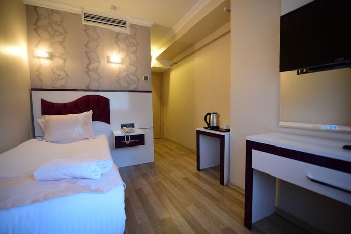 Imagen de la habitación del &Ouml;zdemir Palas Hotel. Foto 4