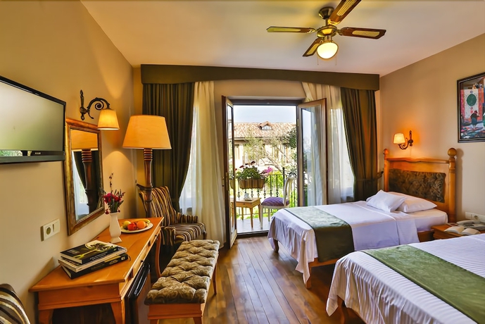 Imagen de la habitación del Palace Hotel Olive Odore. Foto 17