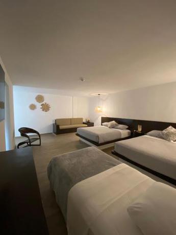 Imagen de la habitación del Palma Dorada Hotel & Boutique. Foto 17