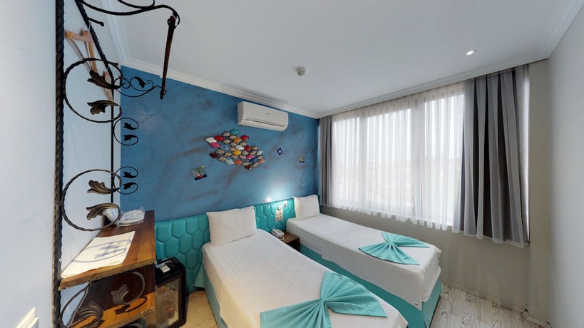 Imagen de la habitación del Patron Hotel. Foto 16