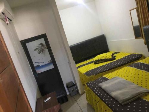 Imagen de la habitación del Penginapan Erbysa. Foto 20