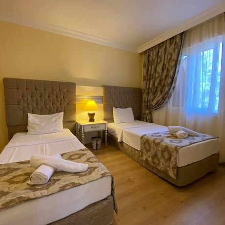 Imagen de la habitación del Pine Villas And Apartments Kusadasi. Foto 17