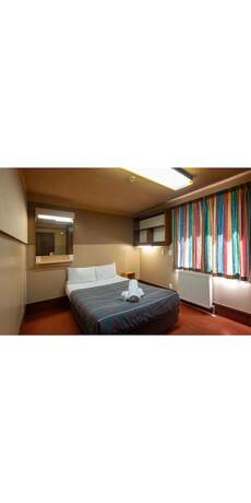 Imagen de la habitación del Pinewood Lodge And Apartments. Foto 29