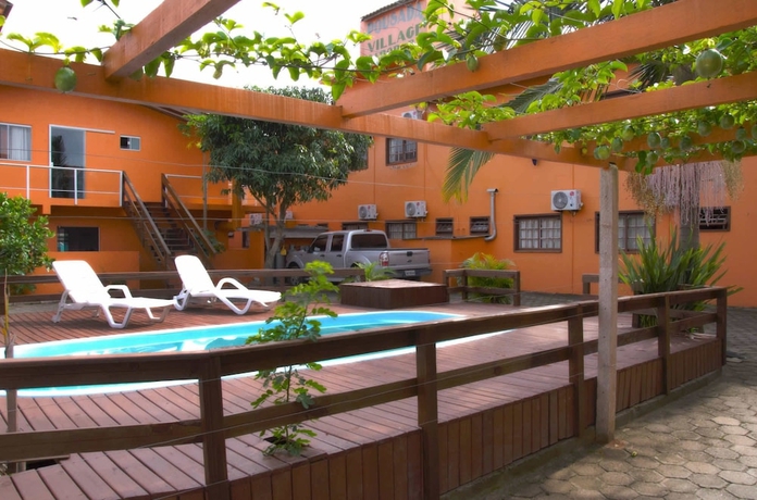 Imagen de la piscina del Pousada Village Garopaba. Foto 11