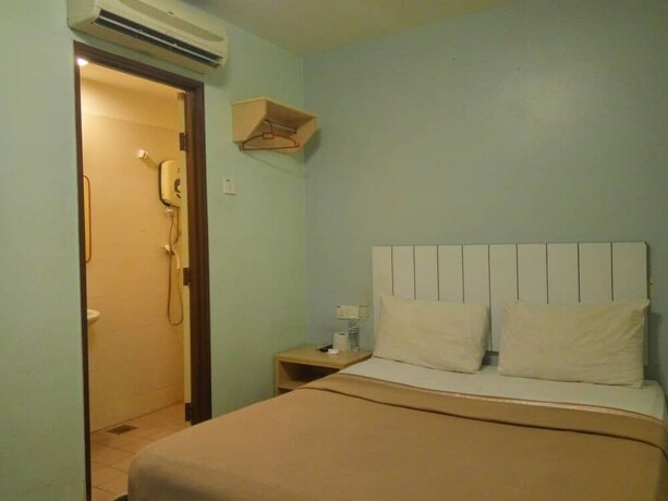 Imagen de la habitación del Pudu Inn Hotel. Foto 8