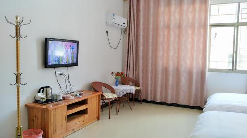 Imagen de la habitación del Qing Qing Inn. Foto 4