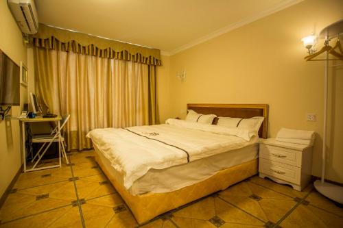 Imagen de la habitación del Qing Yuan Gao Pin Hui Bai Lao Hui Superior Spa Vil. Foto 9