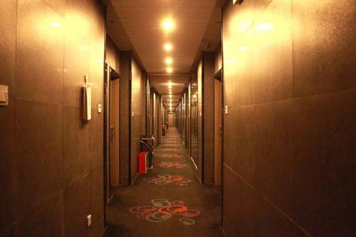 Imagen de la habitación del Qingmu Hotel Ma'anshan Jinying Zhongyang Huayuan B. Foto 9