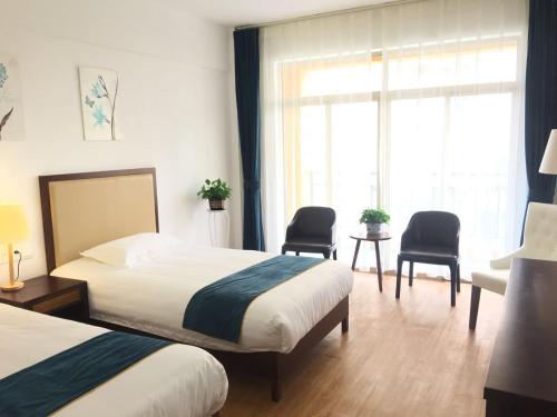 Imagen de la habitación del Qionghai Boao Xishe Guesthouse. Foto 6